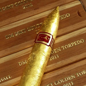 DM Golden Cigar On Top of Boxes